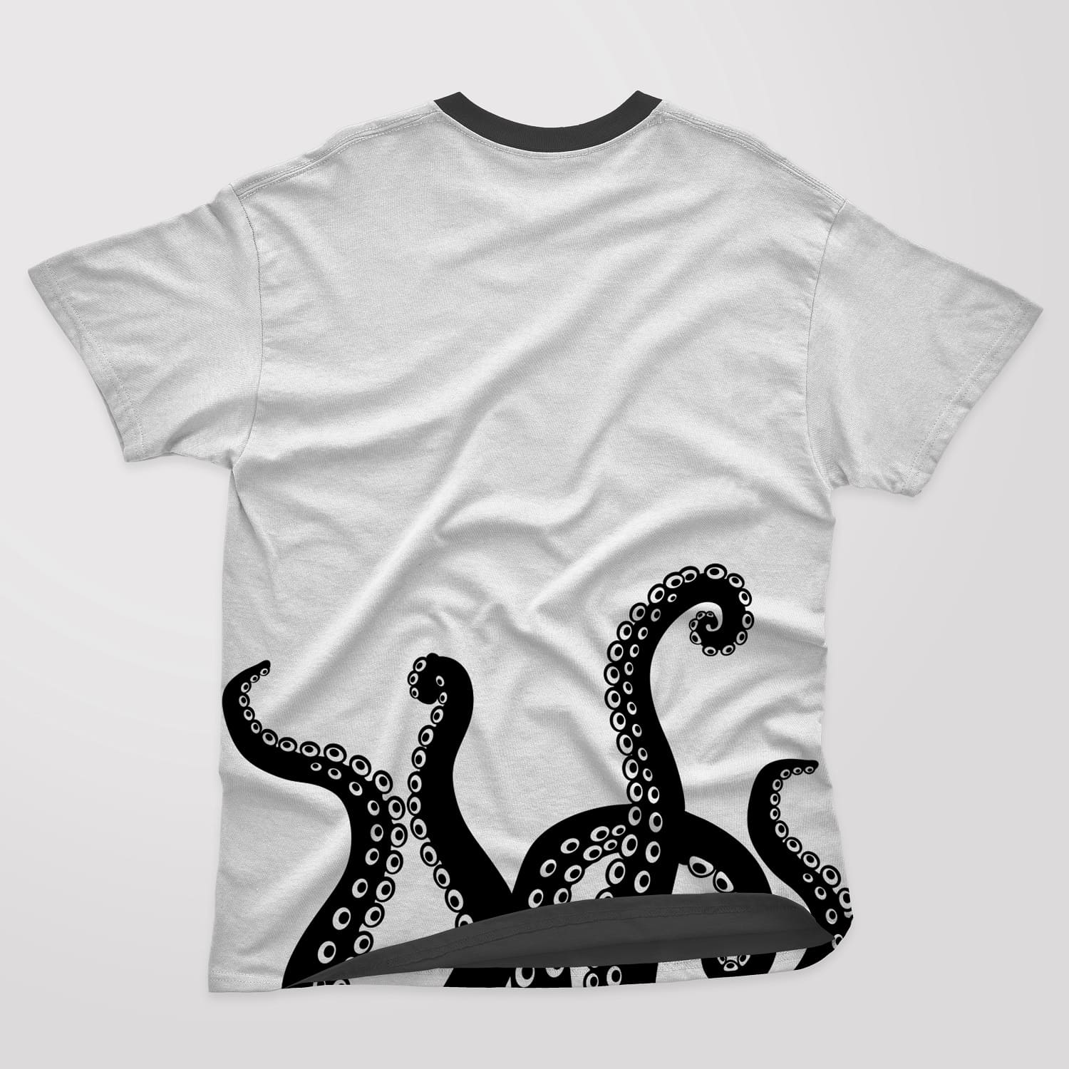 Five black octopus tentacles pointing upwards on a white t-shirt.