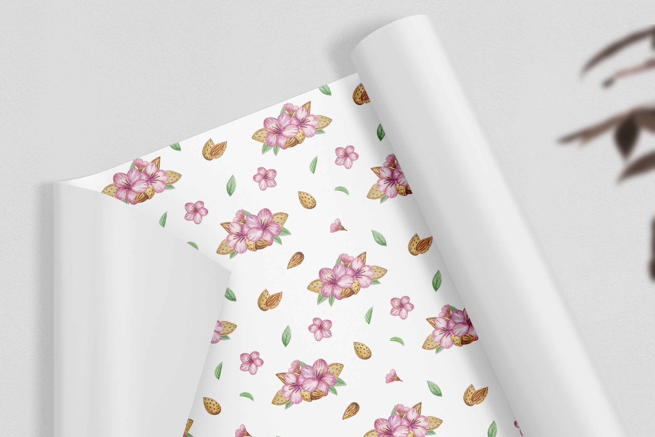 White wrapping paper with almond flowers and nuts.