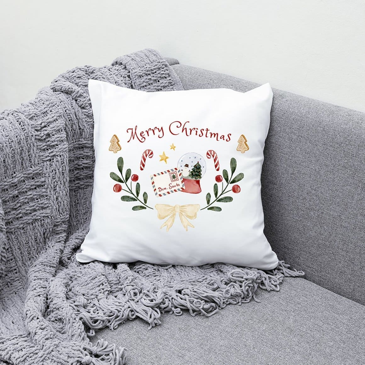 A small white pillow with a New Year's pattern on a gray corner sofa.