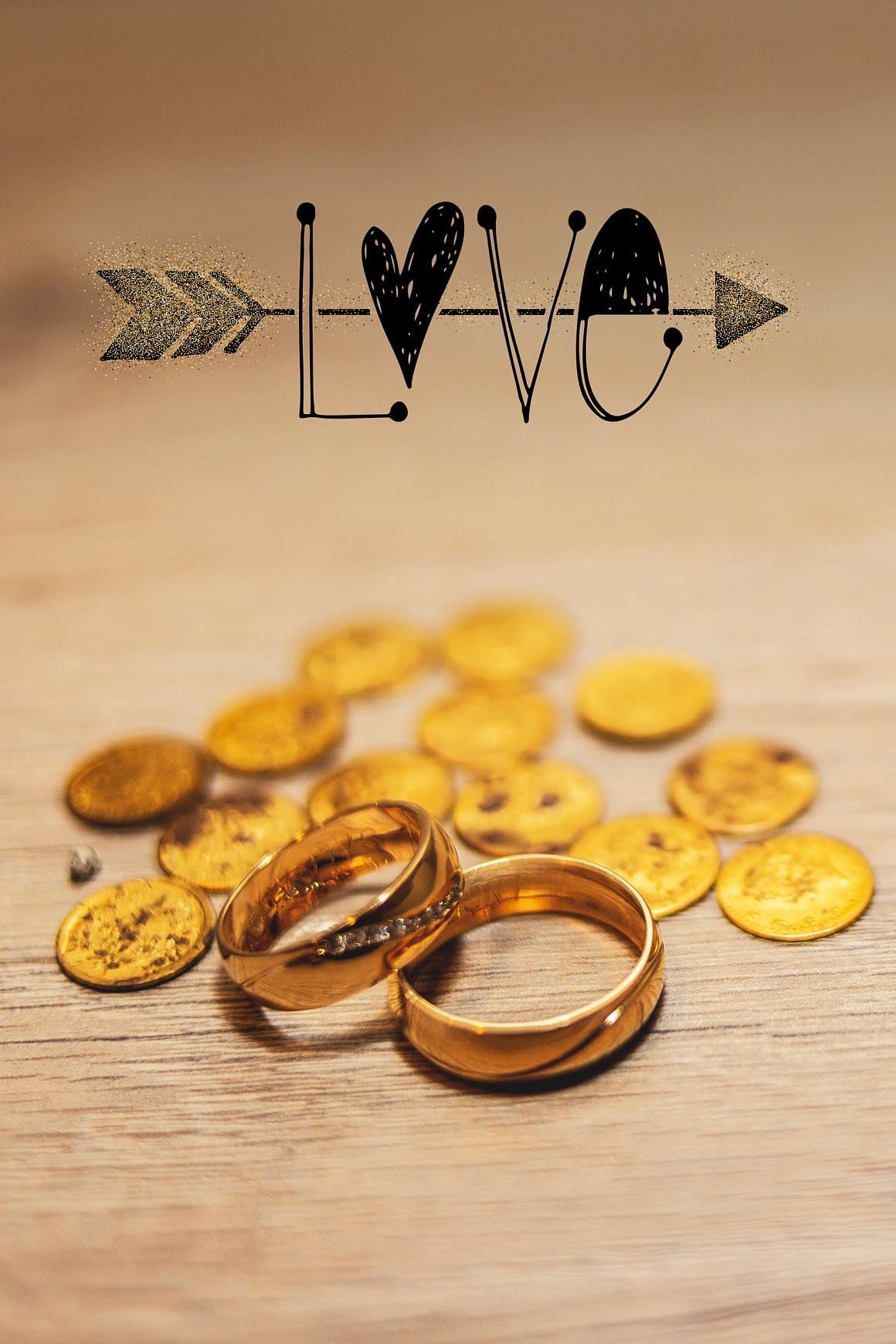 Gold wedding rings and money are on the bottom, and the word "Love" is written on top.