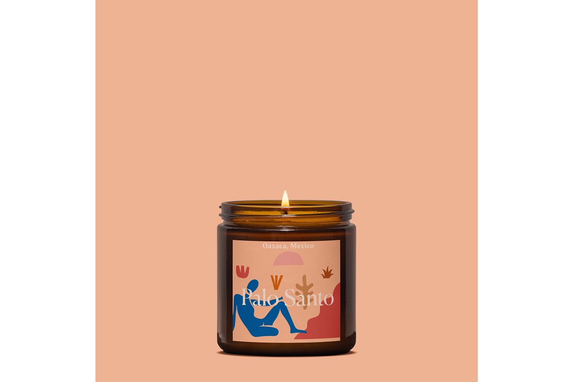 A jar with a candle on a peach background.