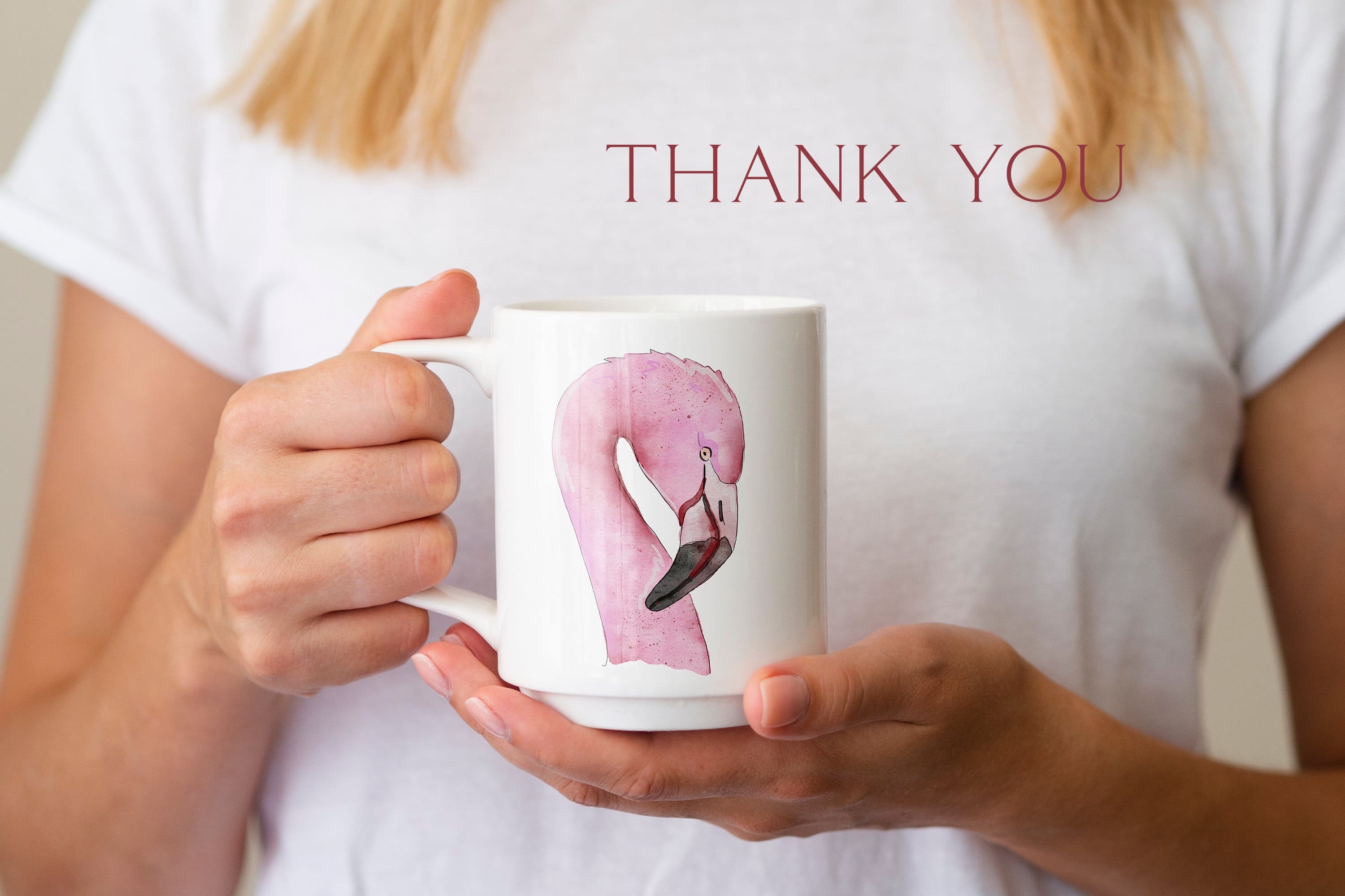The head of a pink flamingo is painted on the white cup.