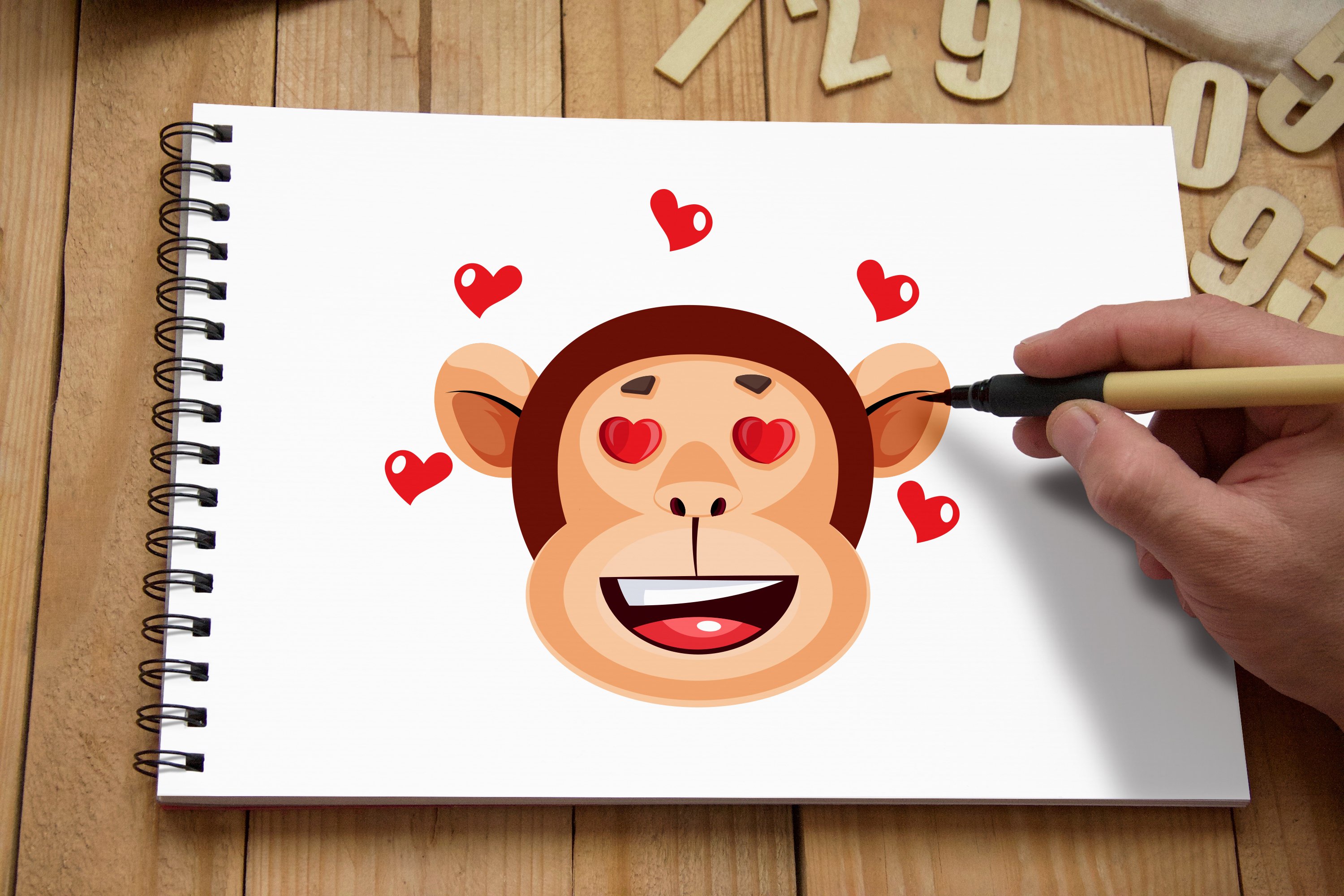 Monkey face with hearts.