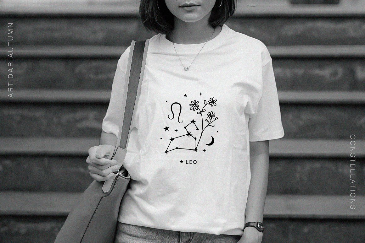 A girl in a white t-shirt with a zodiac print.