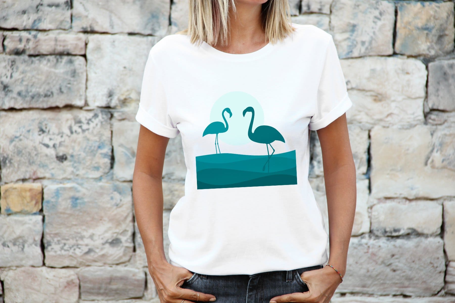 On a white women's T-shirt, romantic sea-colored flamingos are depicted.