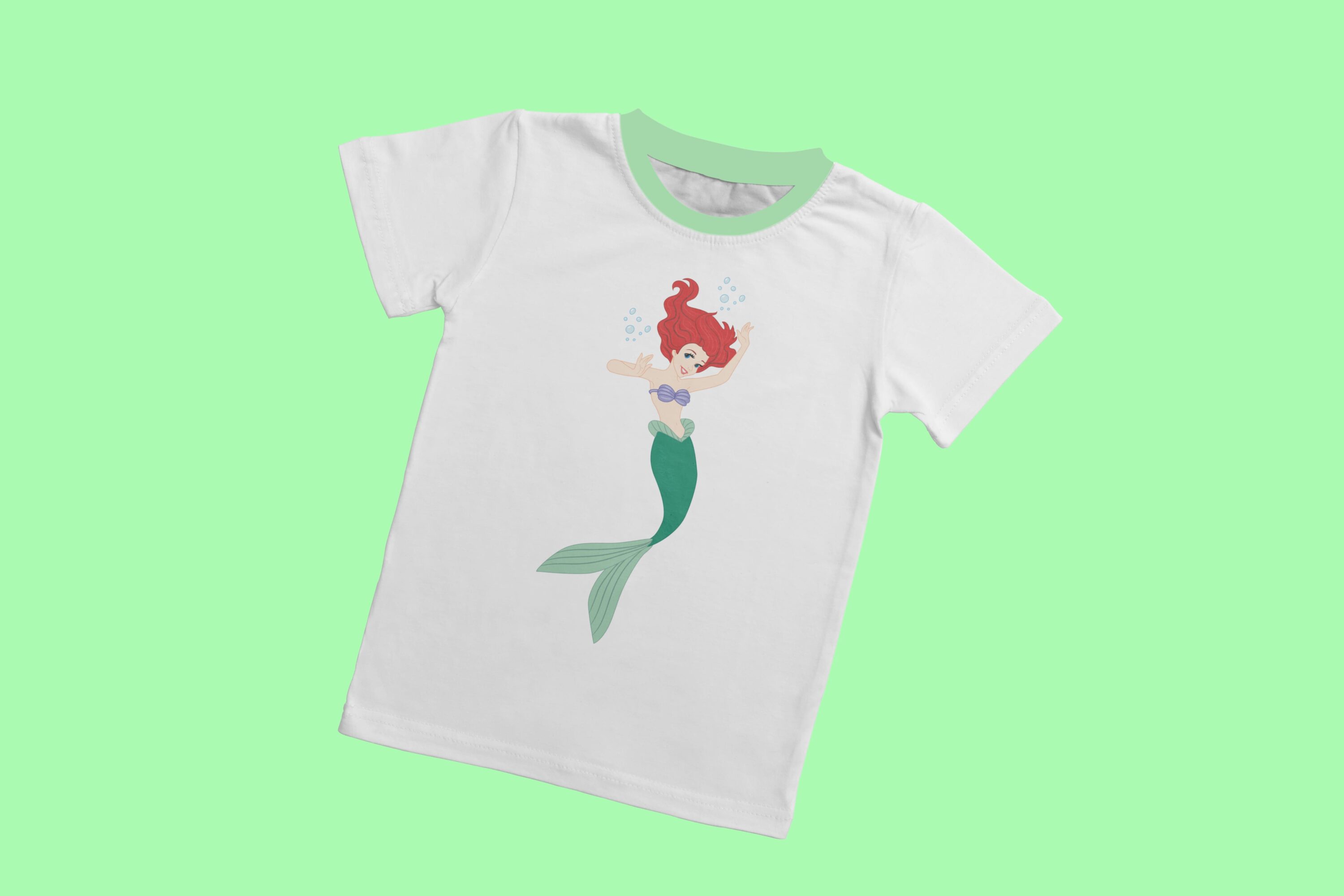 A floating mermaid with red hair and a green tail.