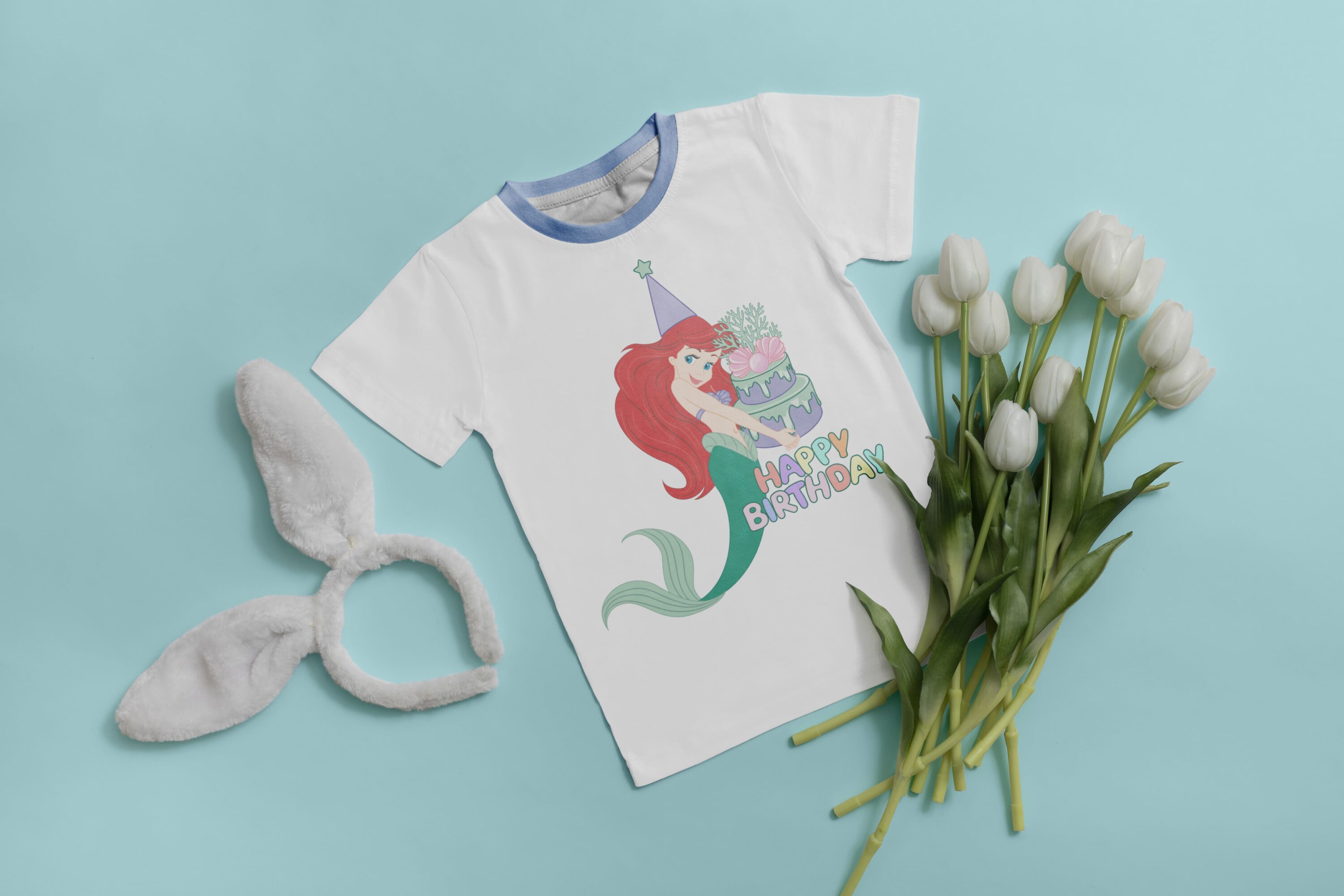 Ears, flowers and print on a mermaid t-shirt.