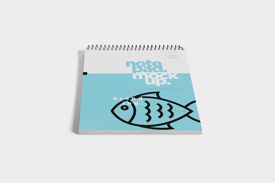 Image of a notebook with a fish print.