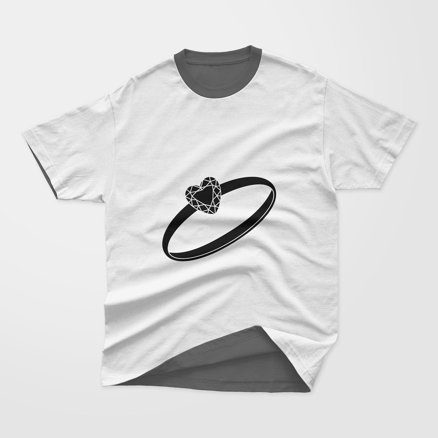 The t-shirt shows wedding rings with a heart-shaped gemstone.
