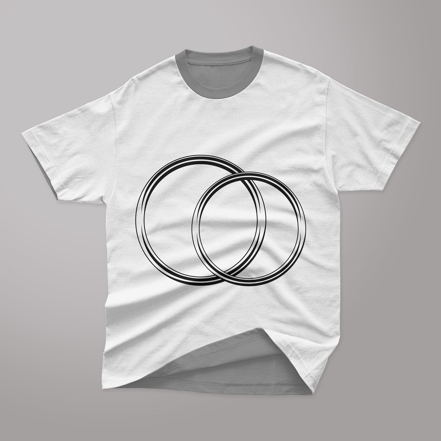 Two thin gold wedding rings are drawn in black on the T-shirt.