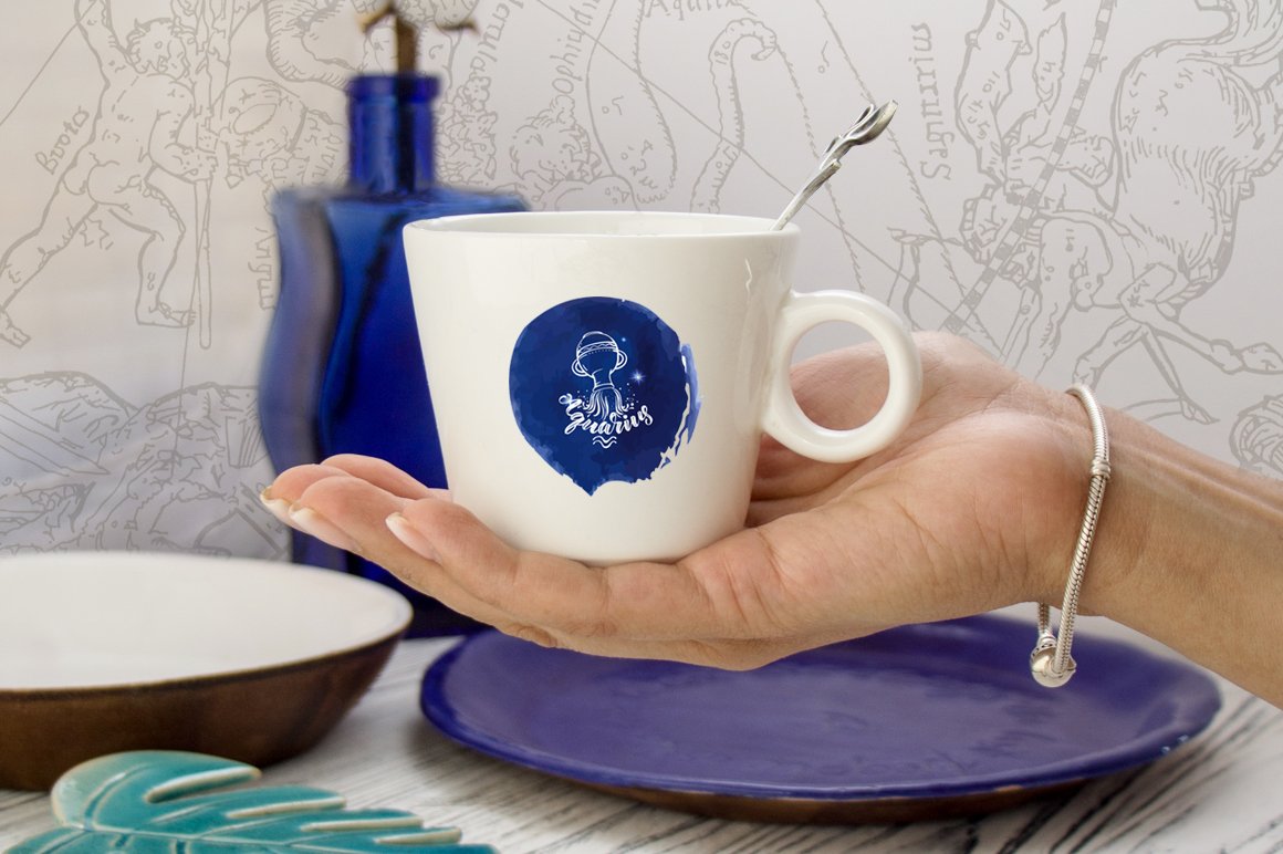 A cup with a zodiac sign print.
