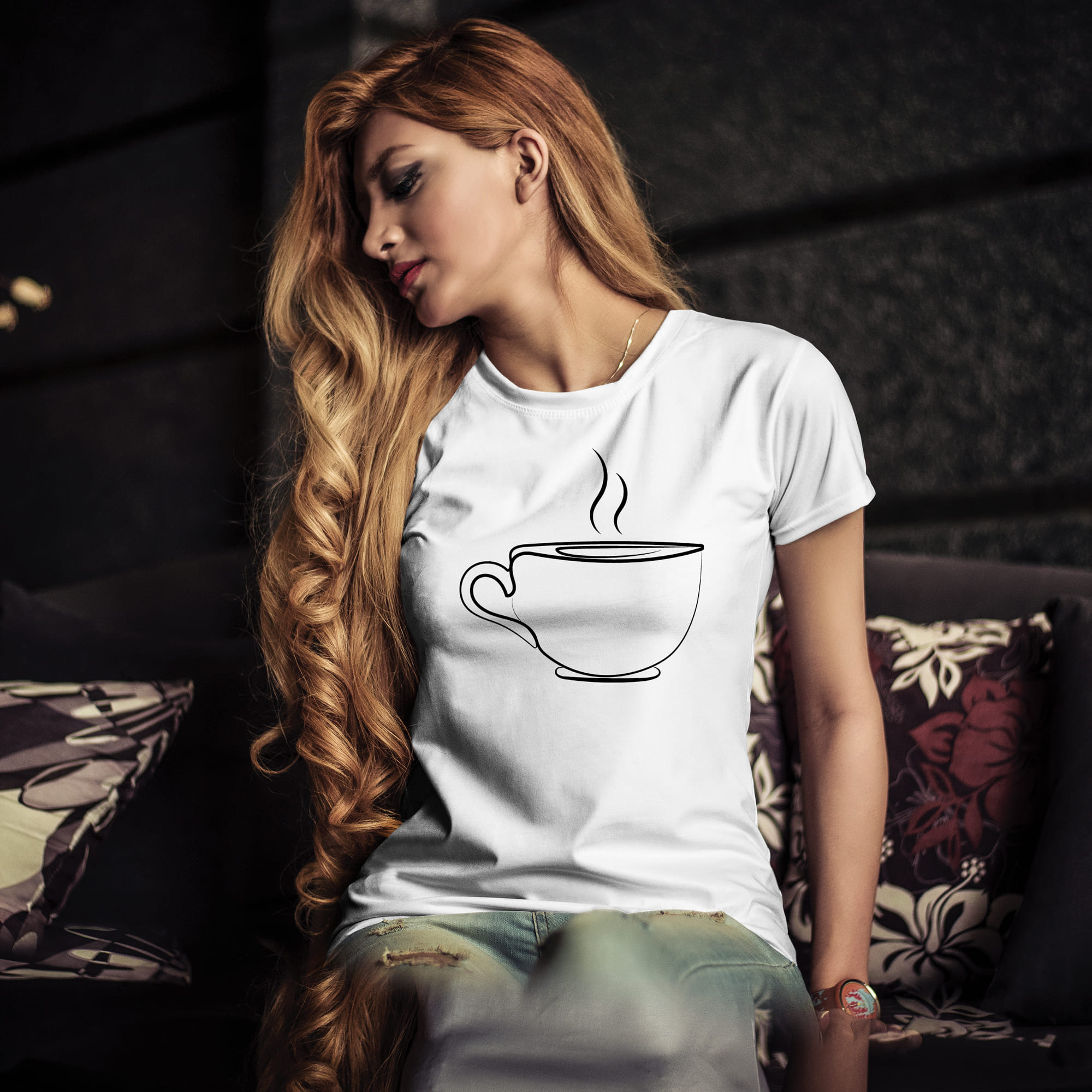 A fragrant cup of coffee is drawn on a white T-shirt.