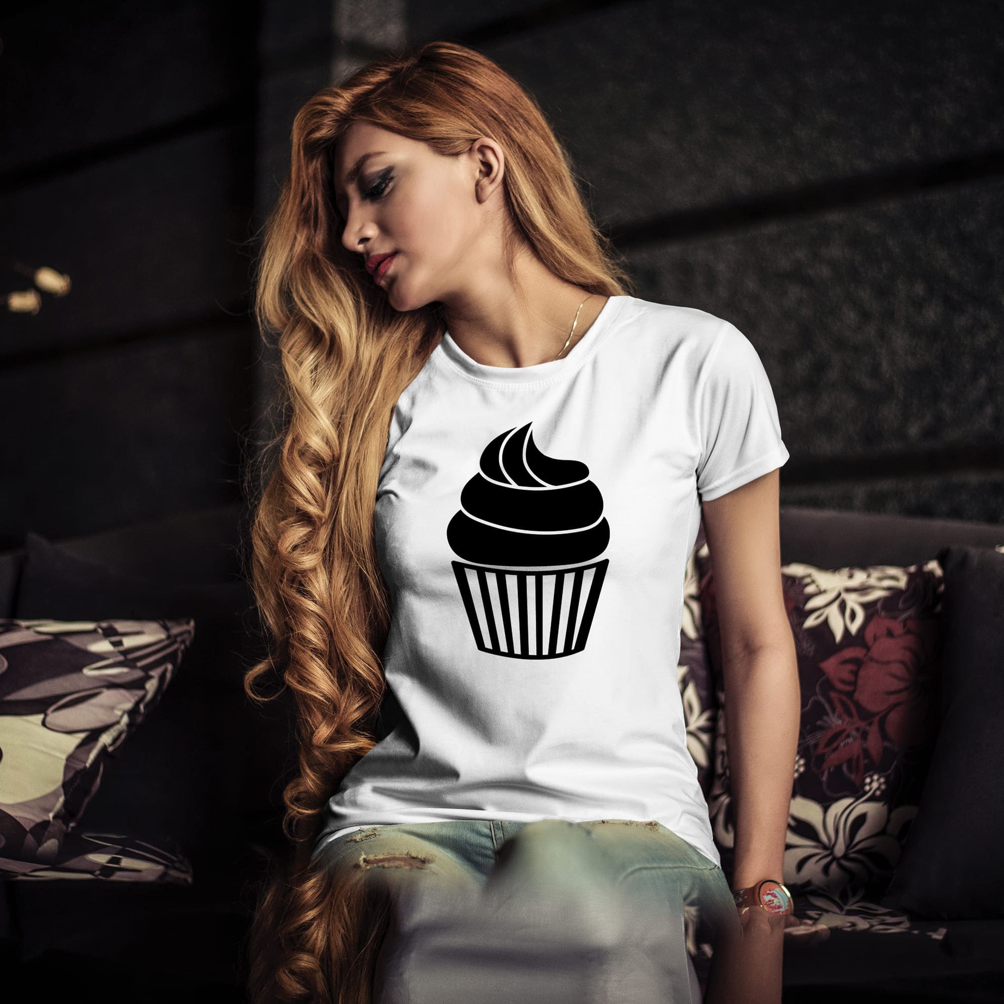 Cupcakes with chocolate cream painted on a girl's white t-shirt.