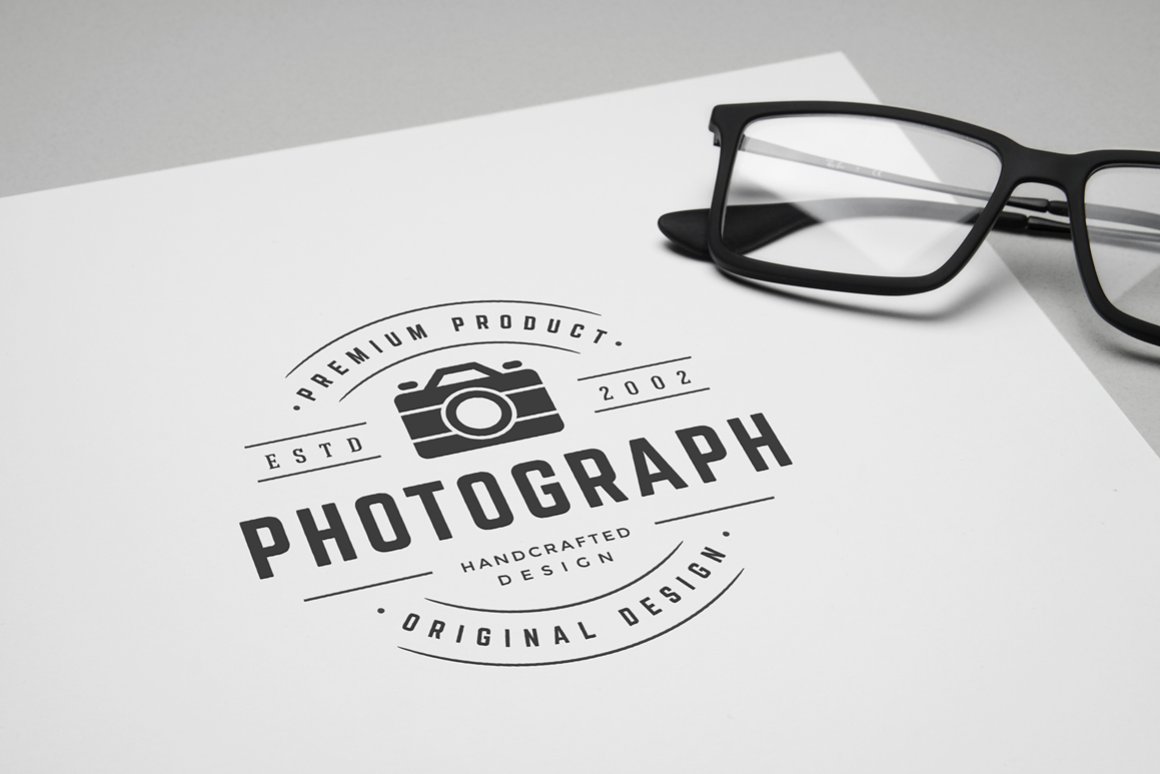 Logo with a camera on paper.