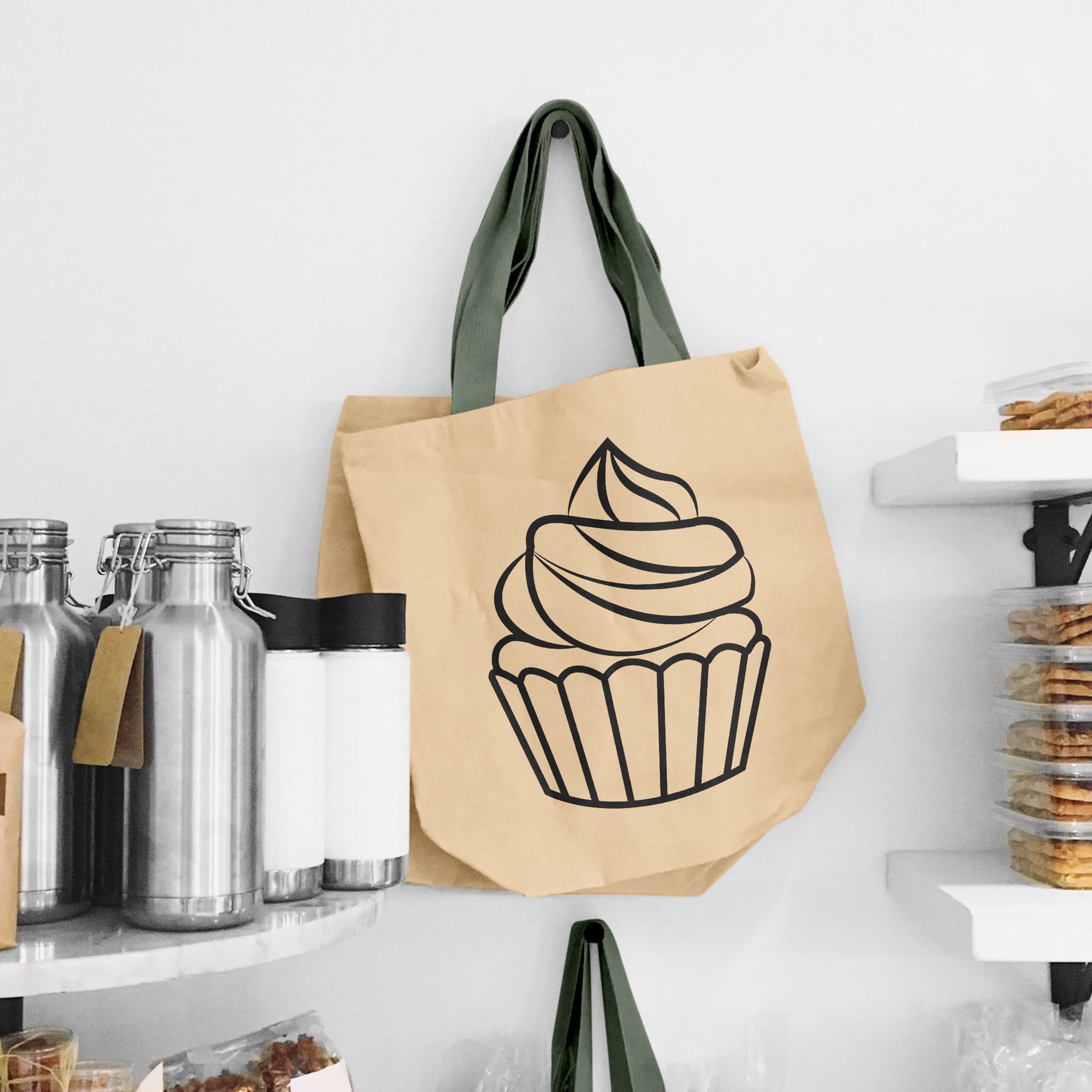 The outline of the cupcake is drawn on a grocery bag.