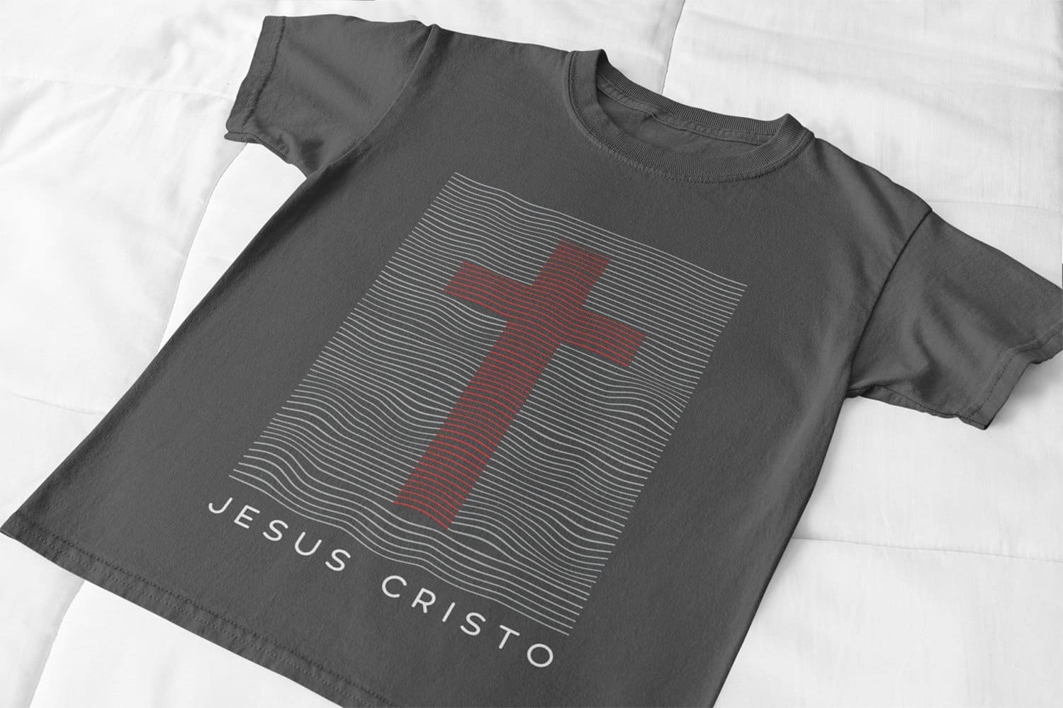 The inscription Jesus Christ under a red cross on a black T-shirt.