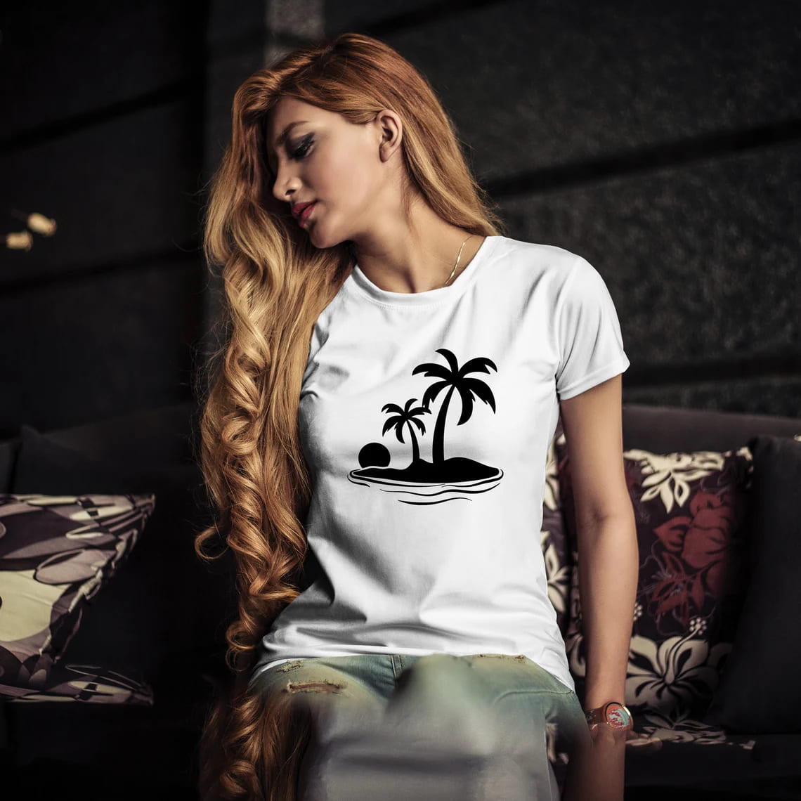 A girl in a white t-shirt with the image of palm trees.