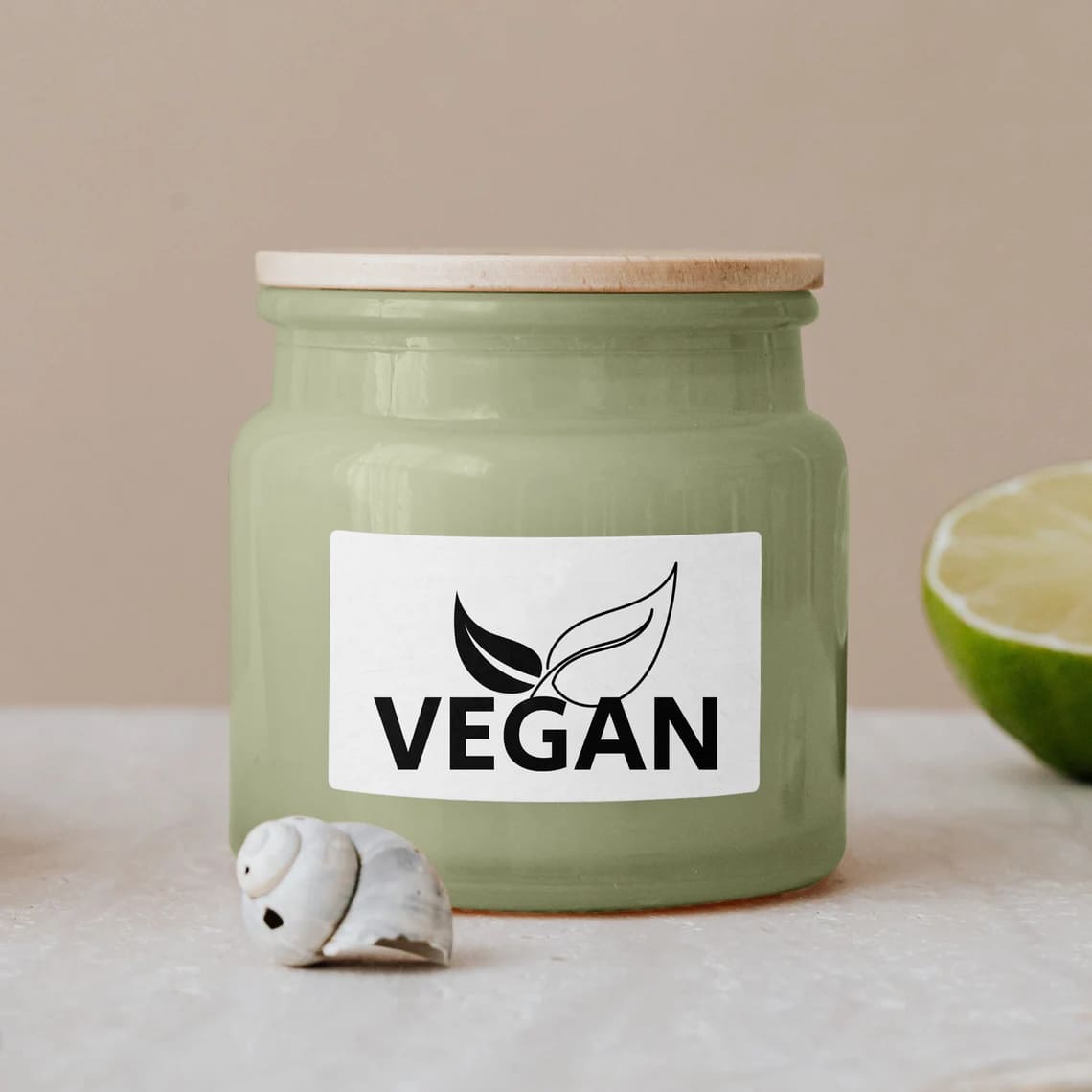 Vegan is written on the green cosmetic jar.
