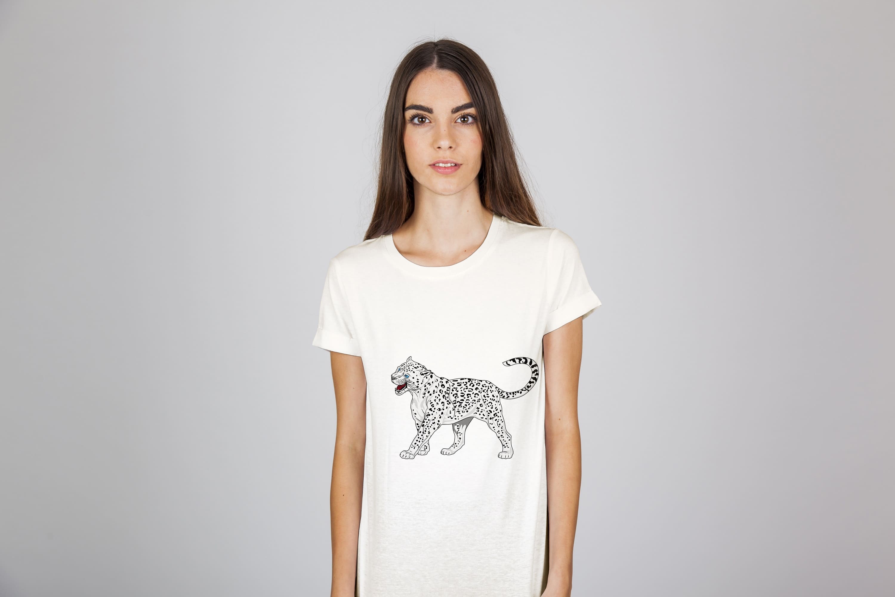 A snow leopard with a grin on a white t-shirt.