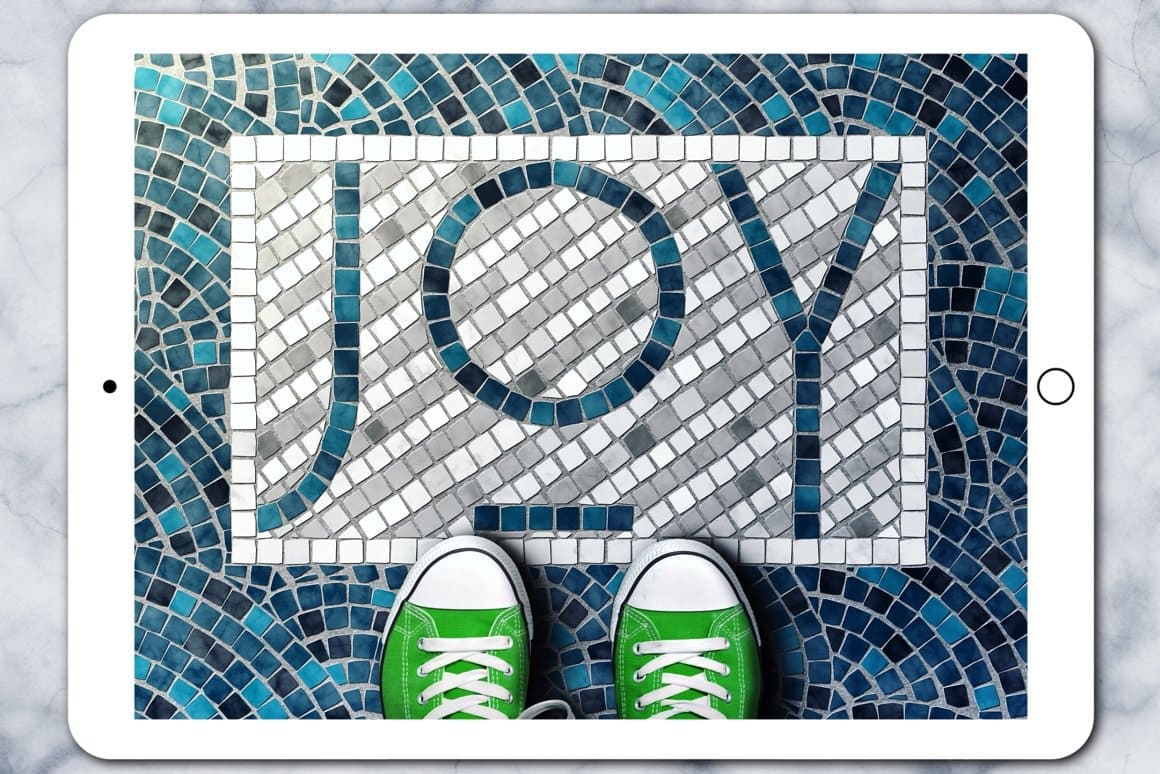 The word "Joy" is laid out in mosaic on the floor and green sneakers on it.