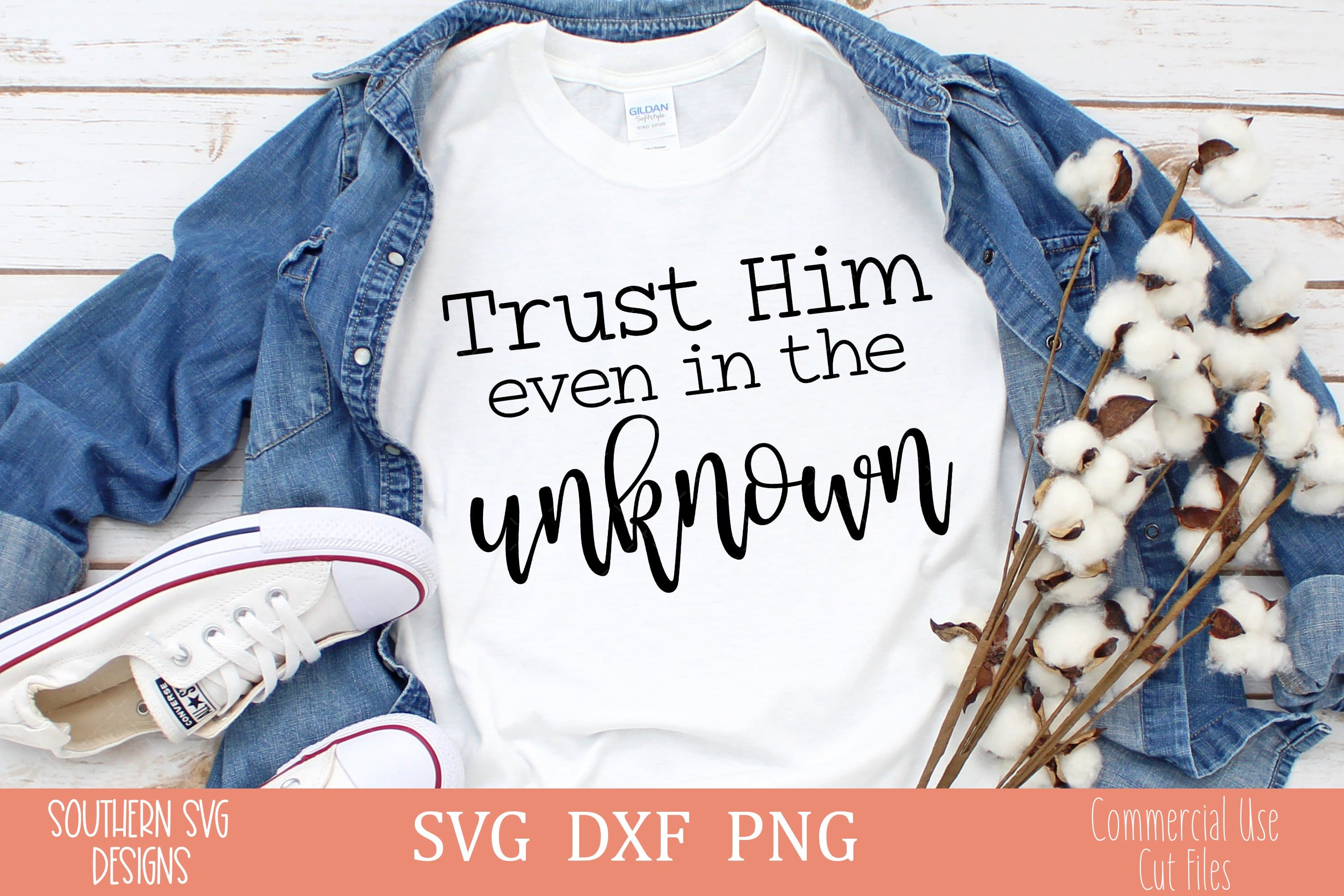 Inscription "trust him even in the unknown" on the white t-shirt.