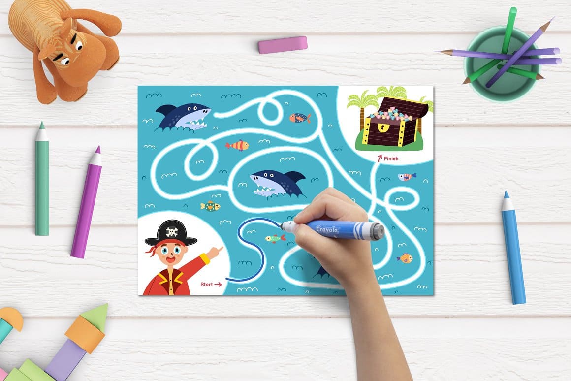 Children's maze drawn on a sheet of paper decorated with sharks, pirates and treasures.