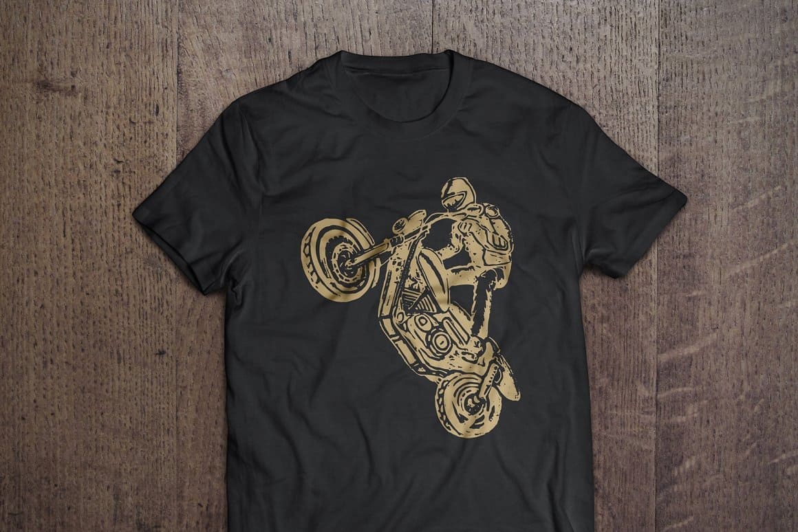 The black T-shirt depicts a motorcyclist on a motorcycle performing a dangerous stunt.