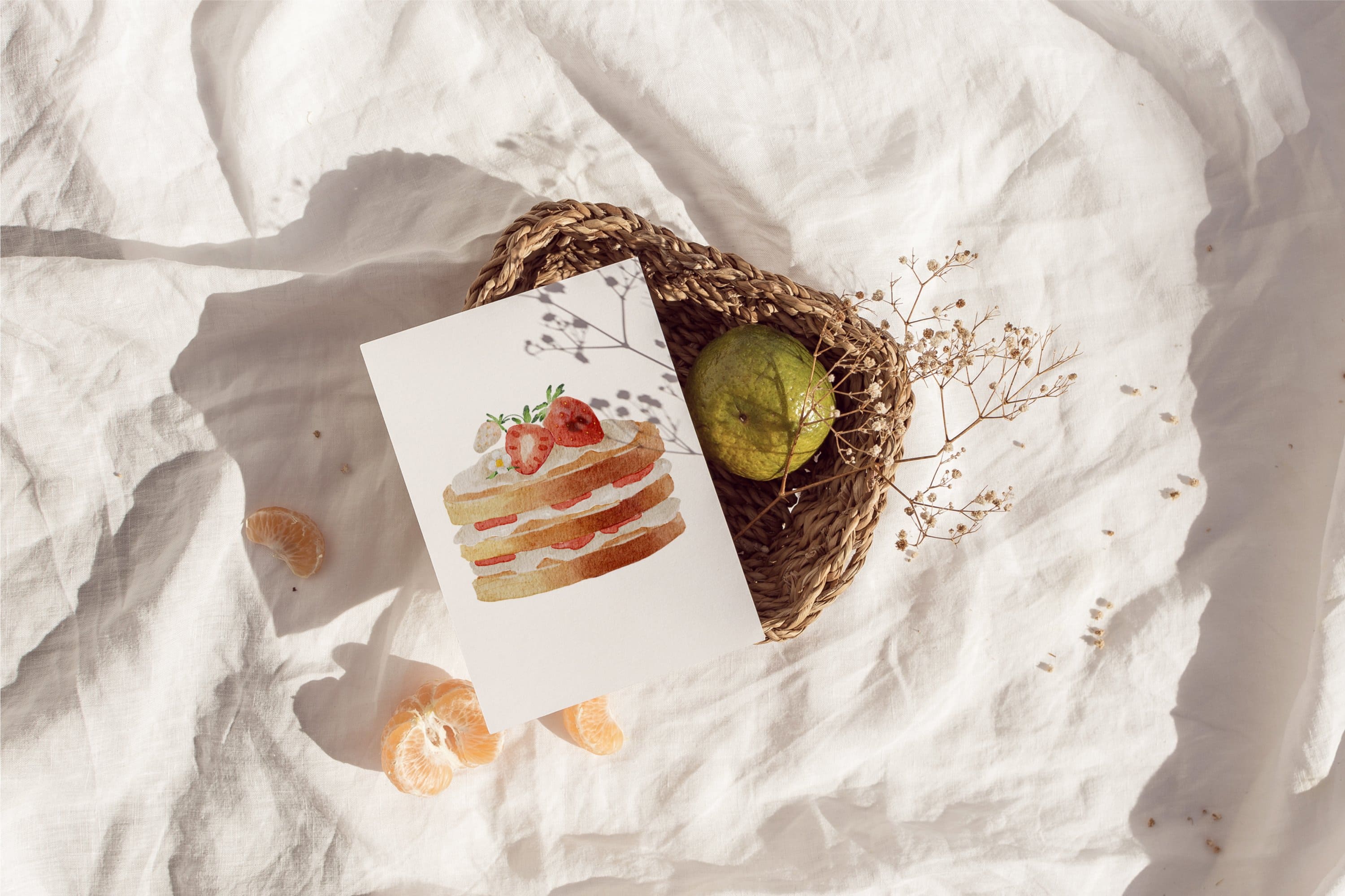 The card depicts a cake with a cake, white cream and strawberries on top.