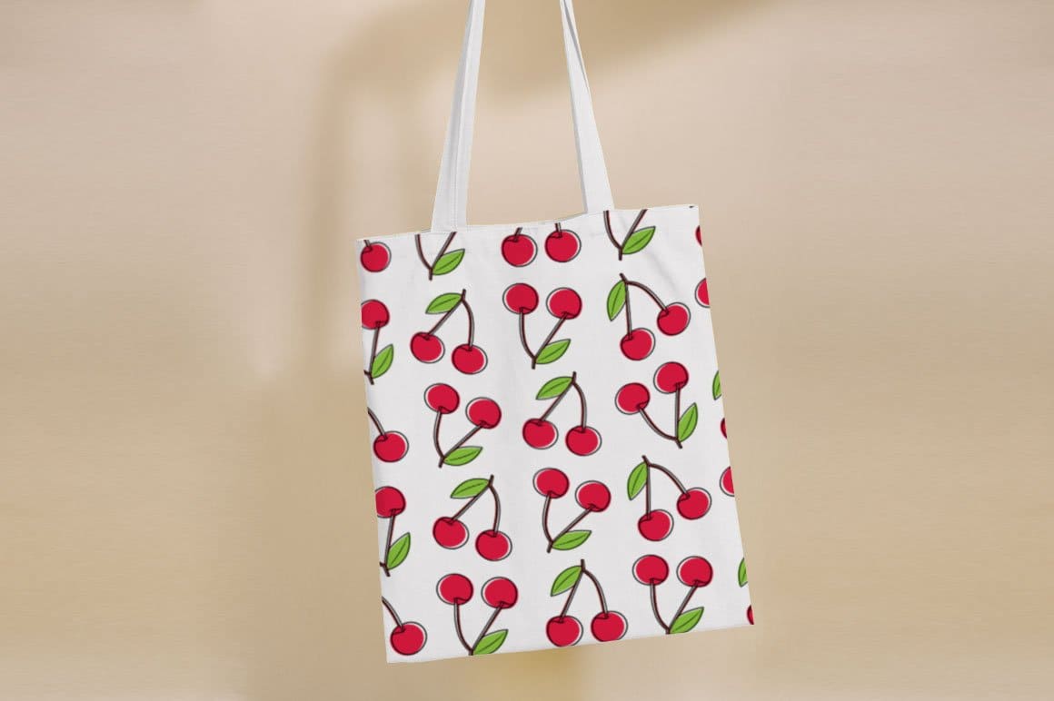 White bag with cherry print.