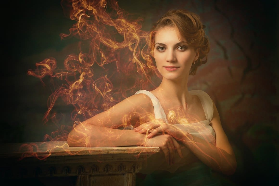 Romantic girl decorated with fiery smoke.