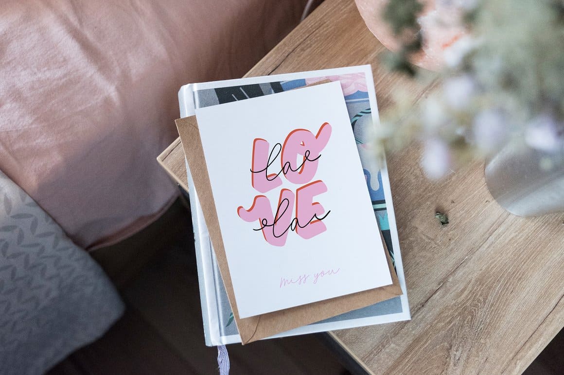 White card with pink love lettering and black minimalist lettering.