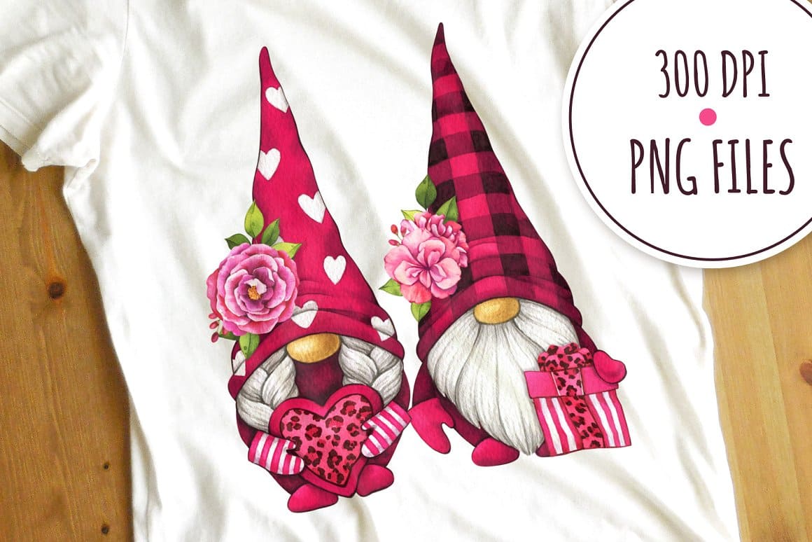 The white t-shirt features two gnomes with big hats in pink for Valentine's Day.