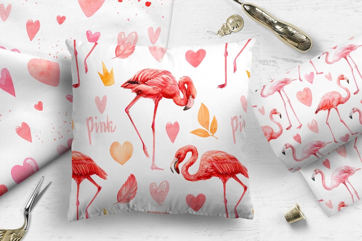 White pillow with the image of pink flamingos and other elements.