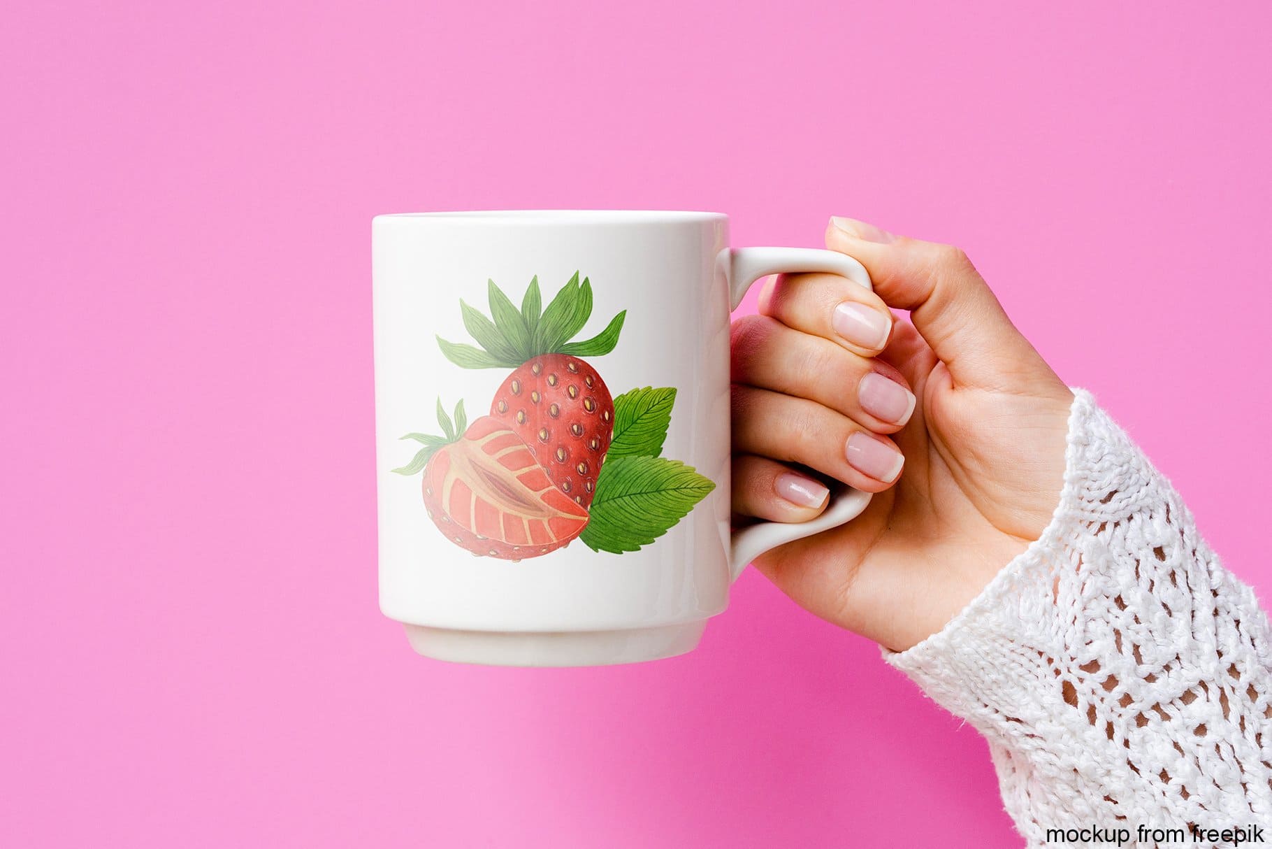 A white cup with drawn strawberries is depicted on a pink background.