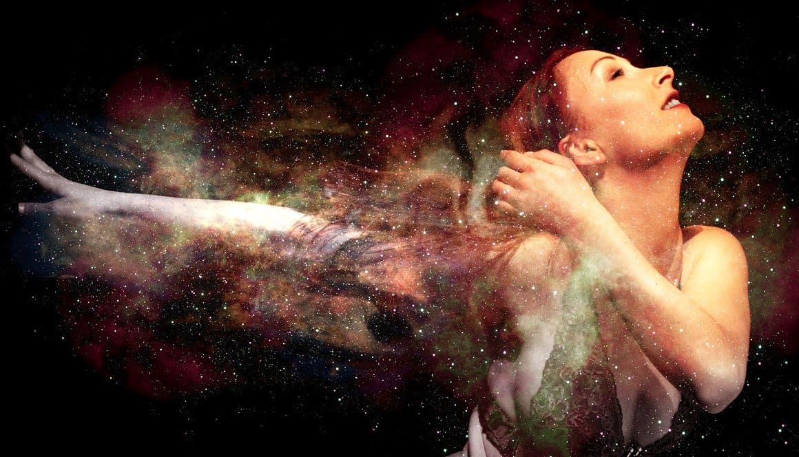 Image of a charming girl dancing in the middle of a fairy-tale cosmic sky.