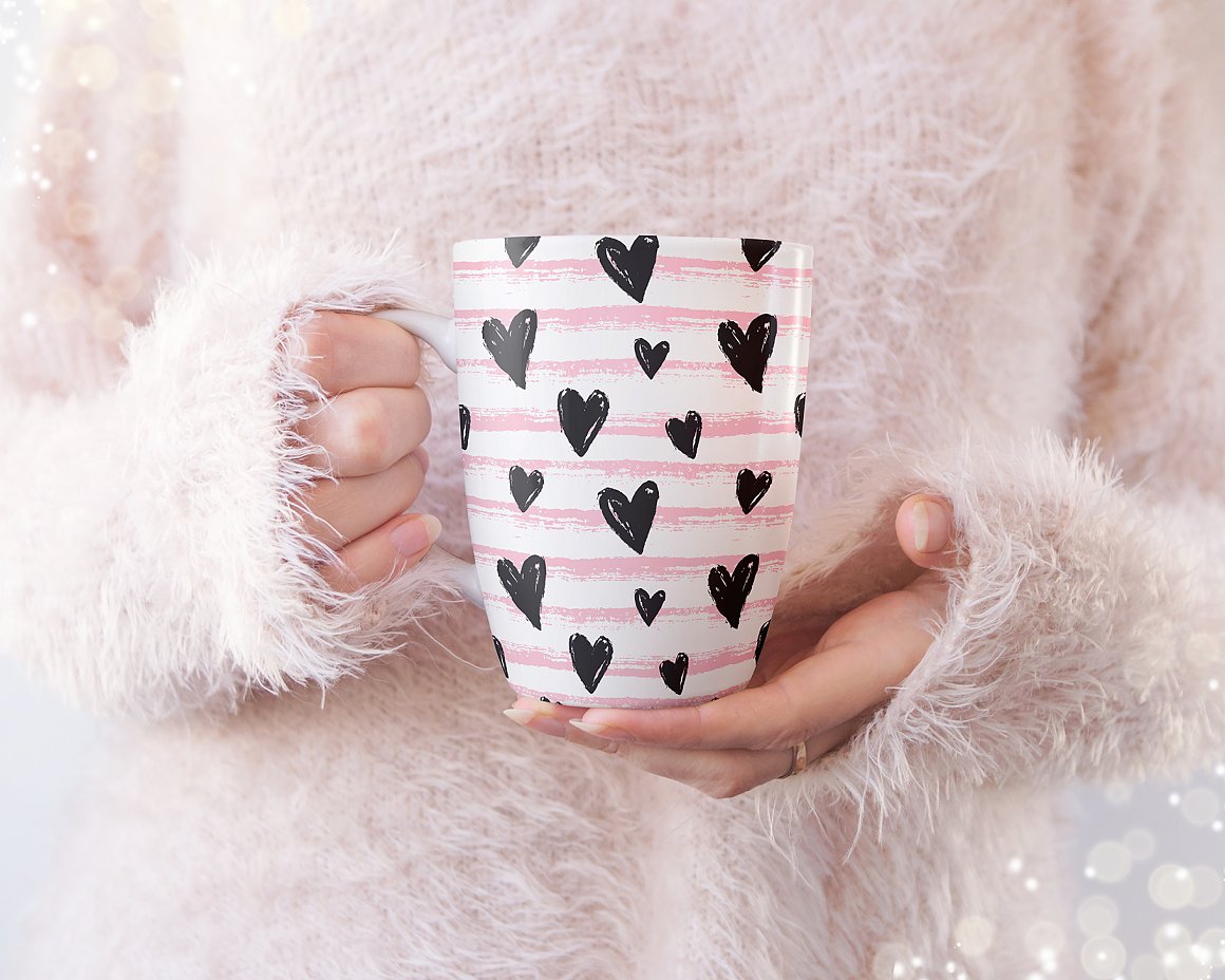 Print with a cup and black hearts.