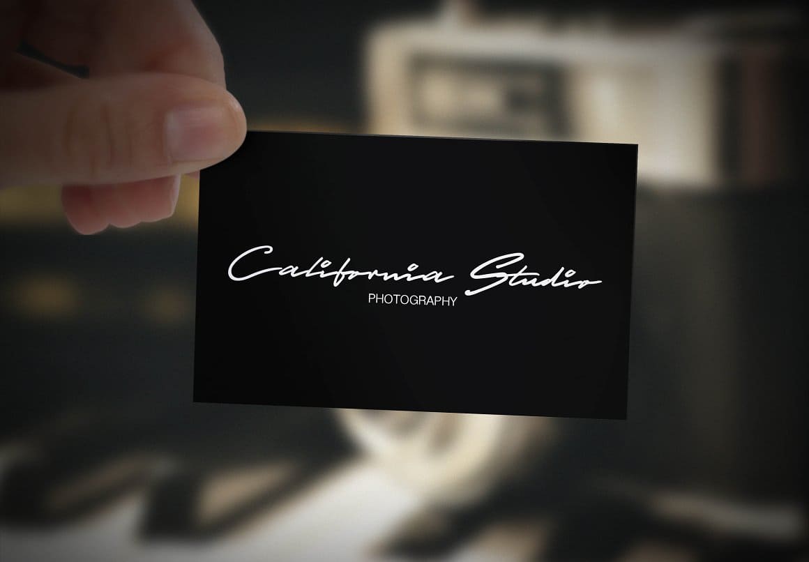 Stylish black business card with a special white handwritten font.