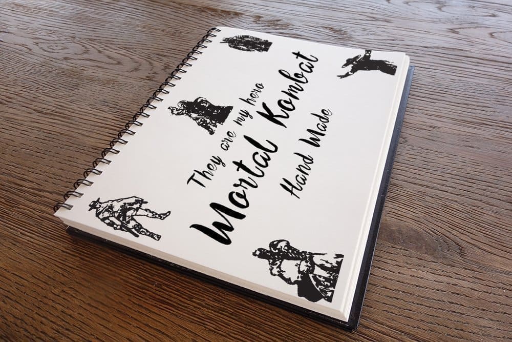 Notebook with springs and the inscription "They are my hero, Mortal Kombat, Hand Made".