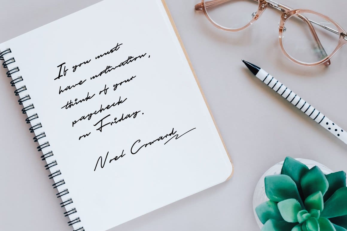 A beautiful handwritten font written with a gel pen in a spring-loaded notebook.