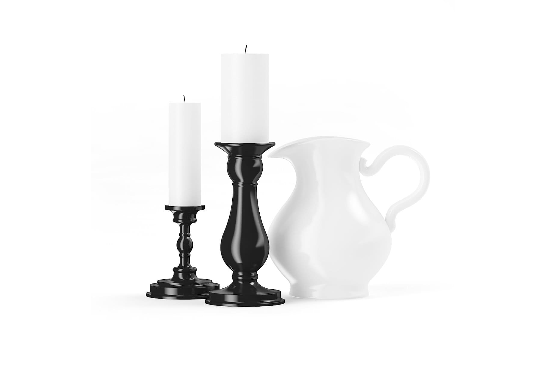 Two white candles on black candlesticks.