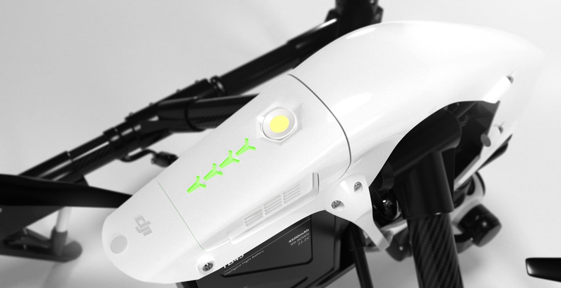A white quadcopter with a white button in the middle.