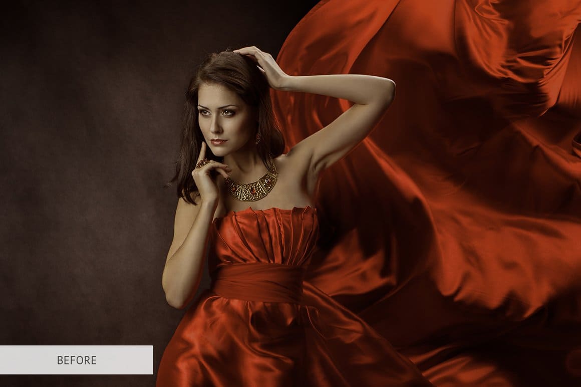 Image of a brunette girl in a red satin dress on a dark background.