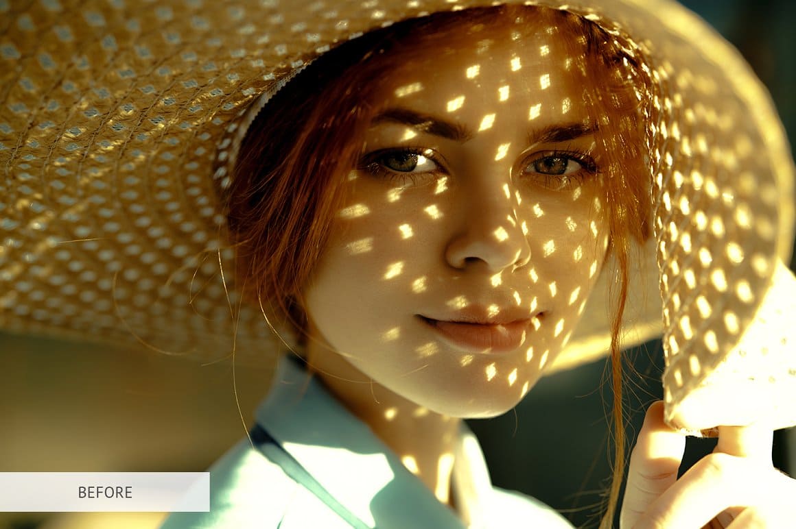 The light falls through the straw hat on the girl.