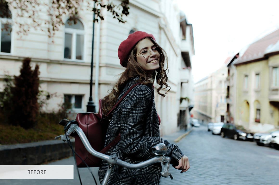 A girl in a red beret on a bicycle.
