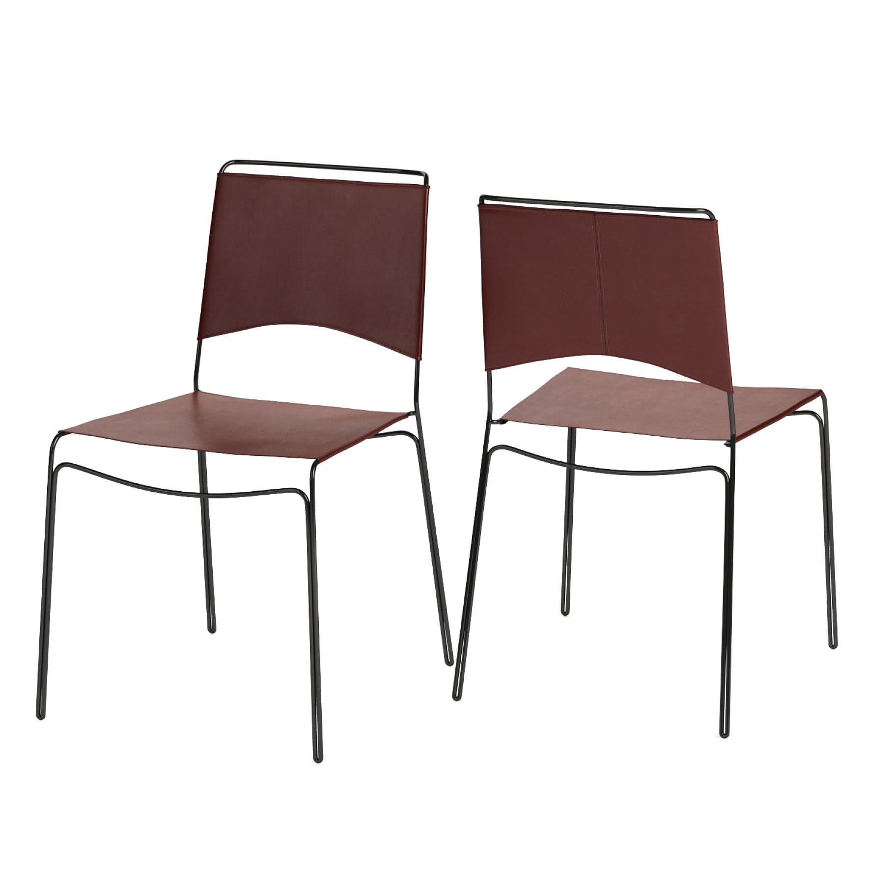 Two dark brown Trace Leather Chairs with a minimalist design.