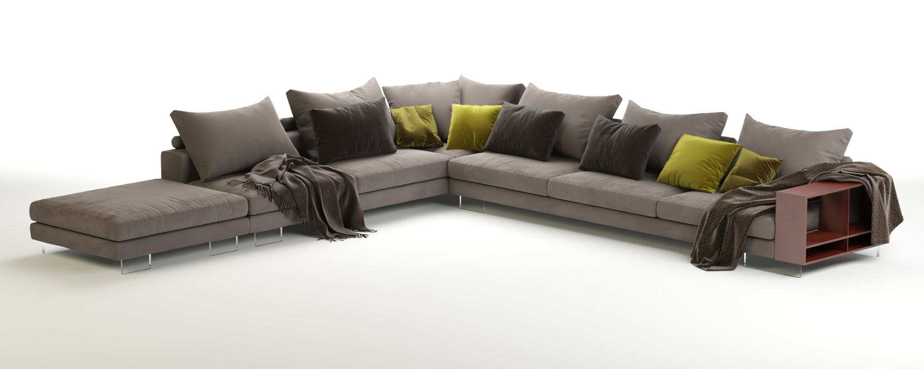 Light gray sofa with gray large pillows and dark gray and green small pillows.