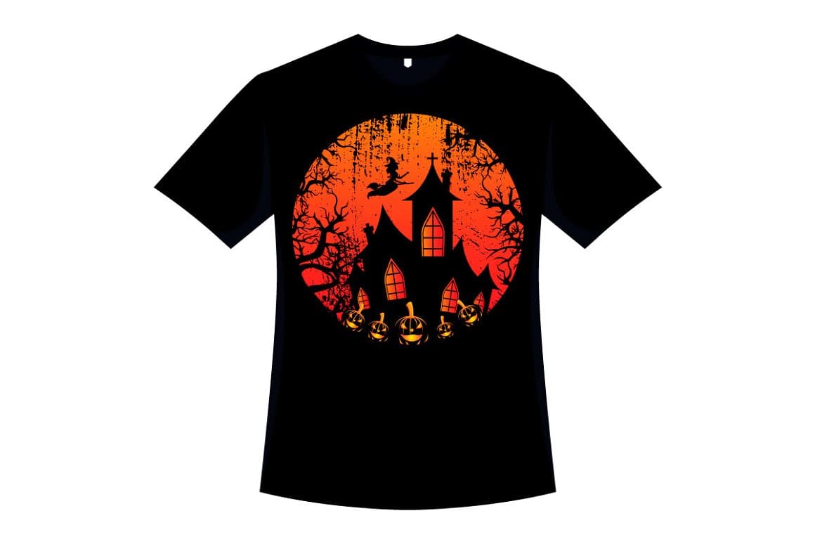 The T-shirt has an orange circle with the image of a building and a witch on a broomstick and black trees.