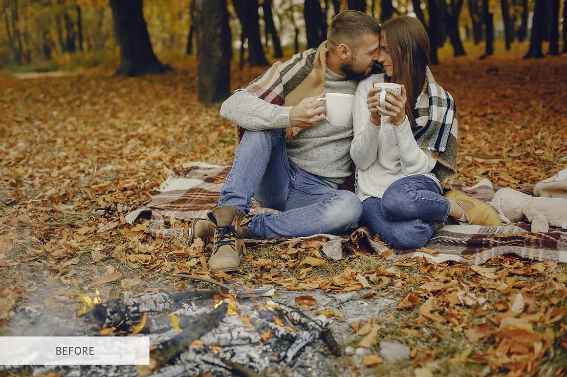 Image of a couple in love drinking tea against the background of autumn leaves.
