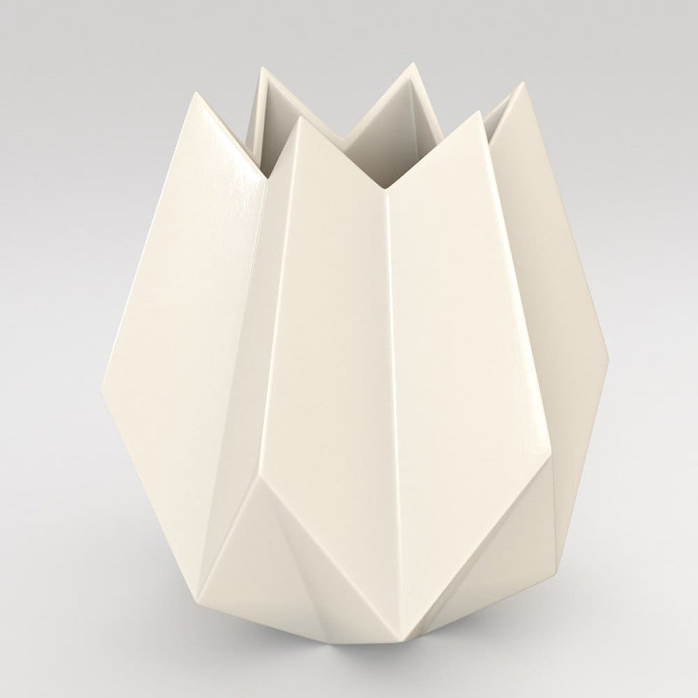 A light beige vase with sharp corners on a light gray background.