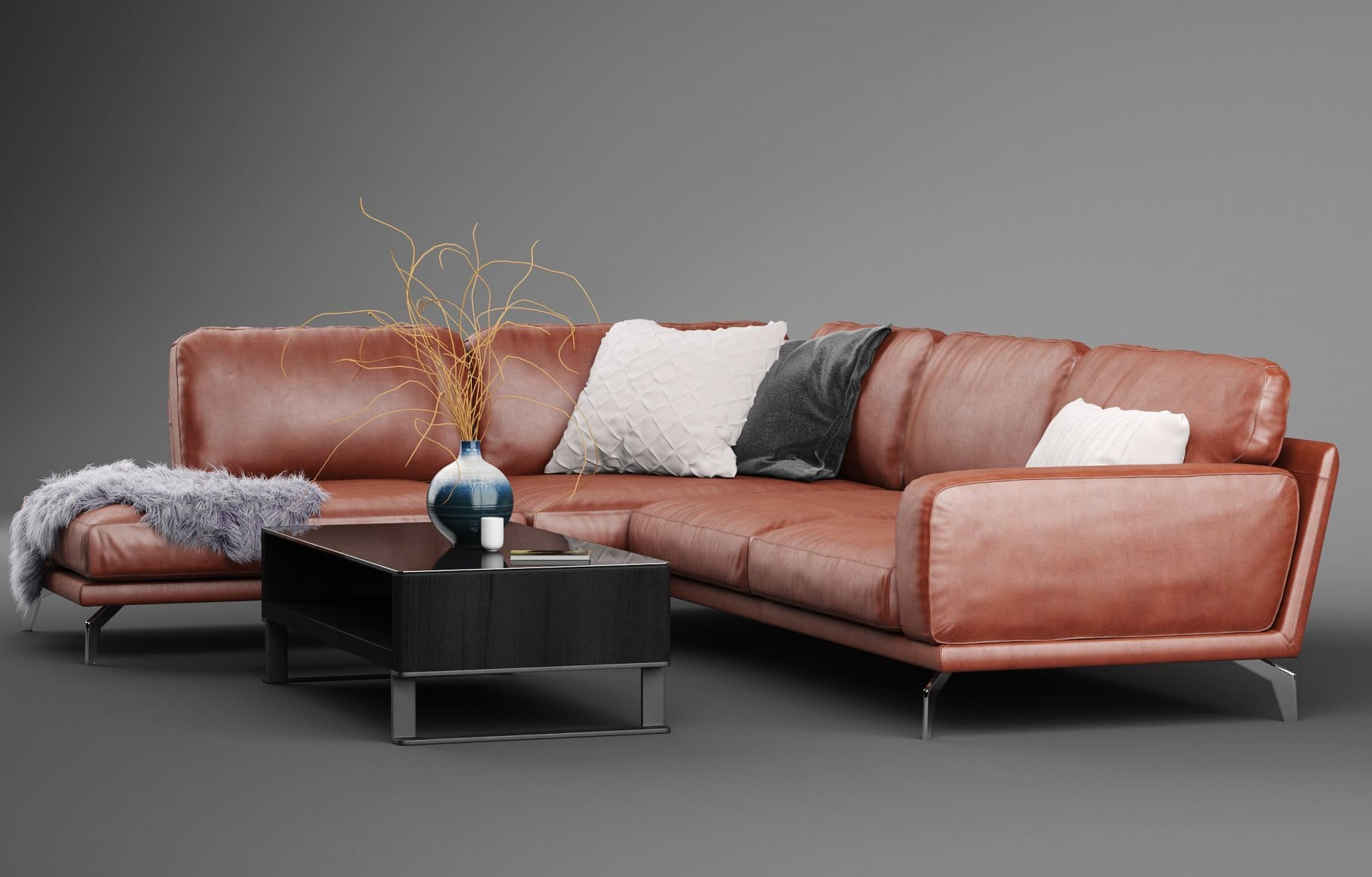 A leather sofa and a coffee table with a white and blue vase are depicted on a gray background.